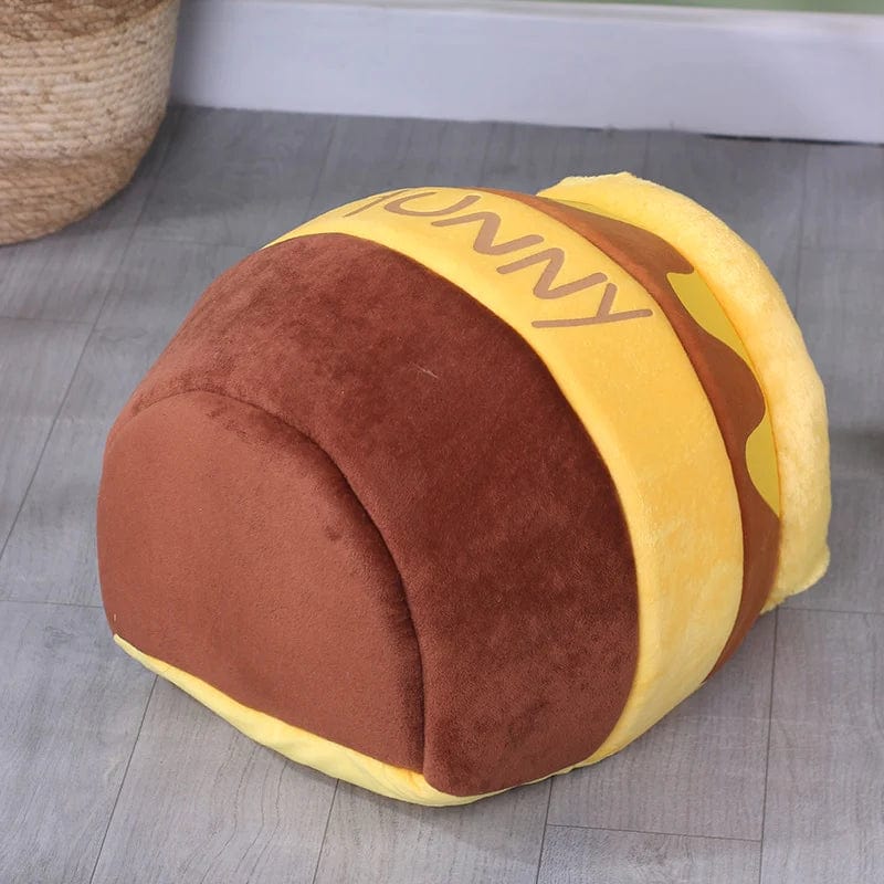 Cozy plush pet bed for cats and small dogs featuring a honey-pot design, ultra-soft fabric, and a comfortable indoor sleeping sanctuary. 7