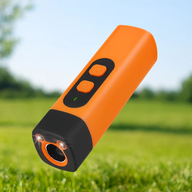 Handheld dog training device in orange, featuring ultrasonic bark control with three modes for gentle correction, USB rechargeable for convenience. 0