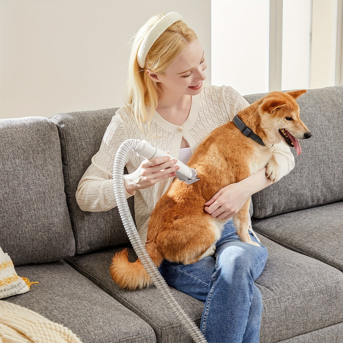5-in-1 pet grooming kit featuring a vacuum and clippers, designed for easy and efficient grooming of dogs and cats, showcasing a sleek design and 7