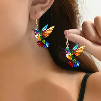 Acrylic hummingbird earrings featuring vibrant rainbow colors, lightweight 2.5-inch statement dangles perfect for adding a pop of color to any outfit. 0