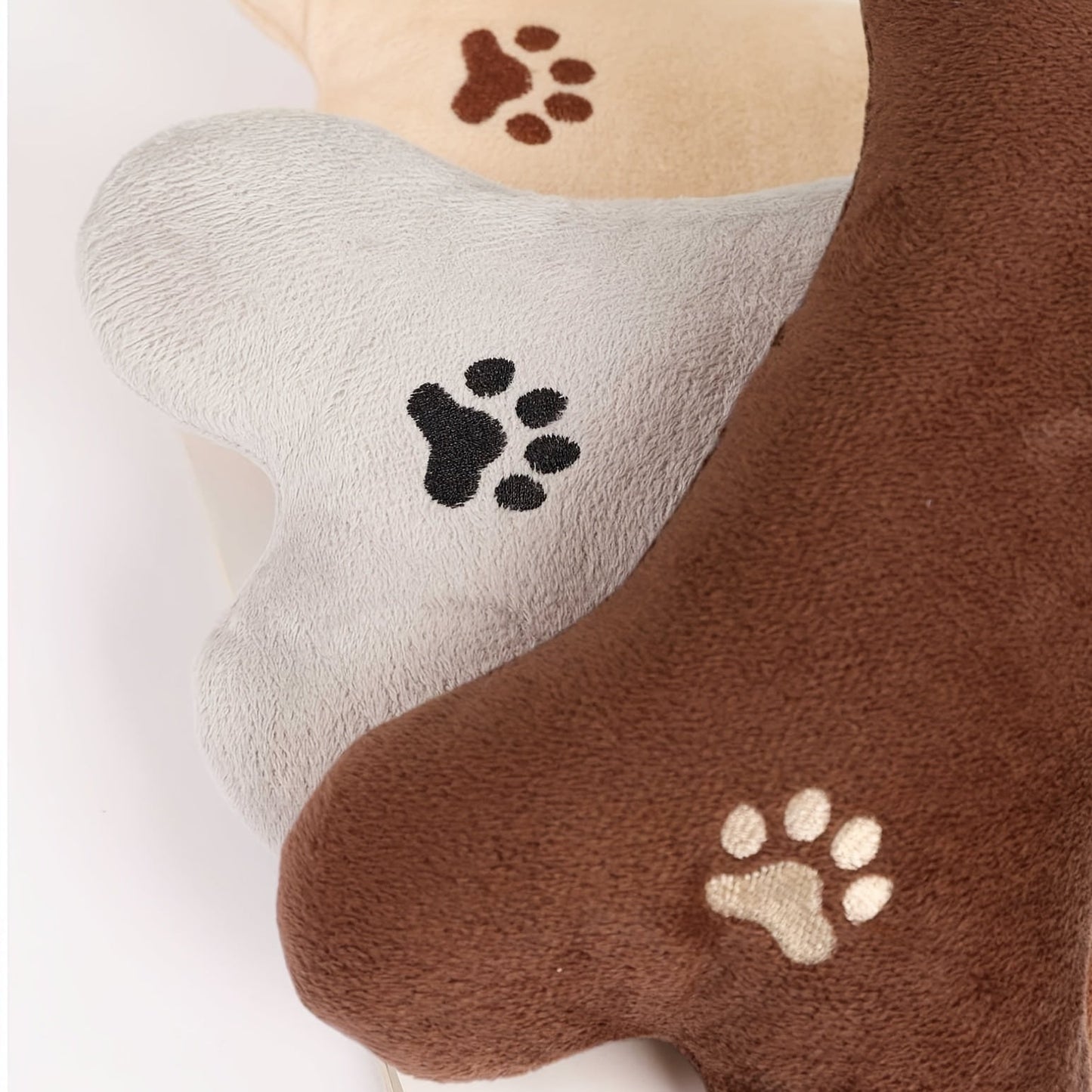 Bone-shaped plush pet pillow designed for small to medium dogs and cats, featuring a soft, washable fabric for ultimate comfort and easy cleaning. 6