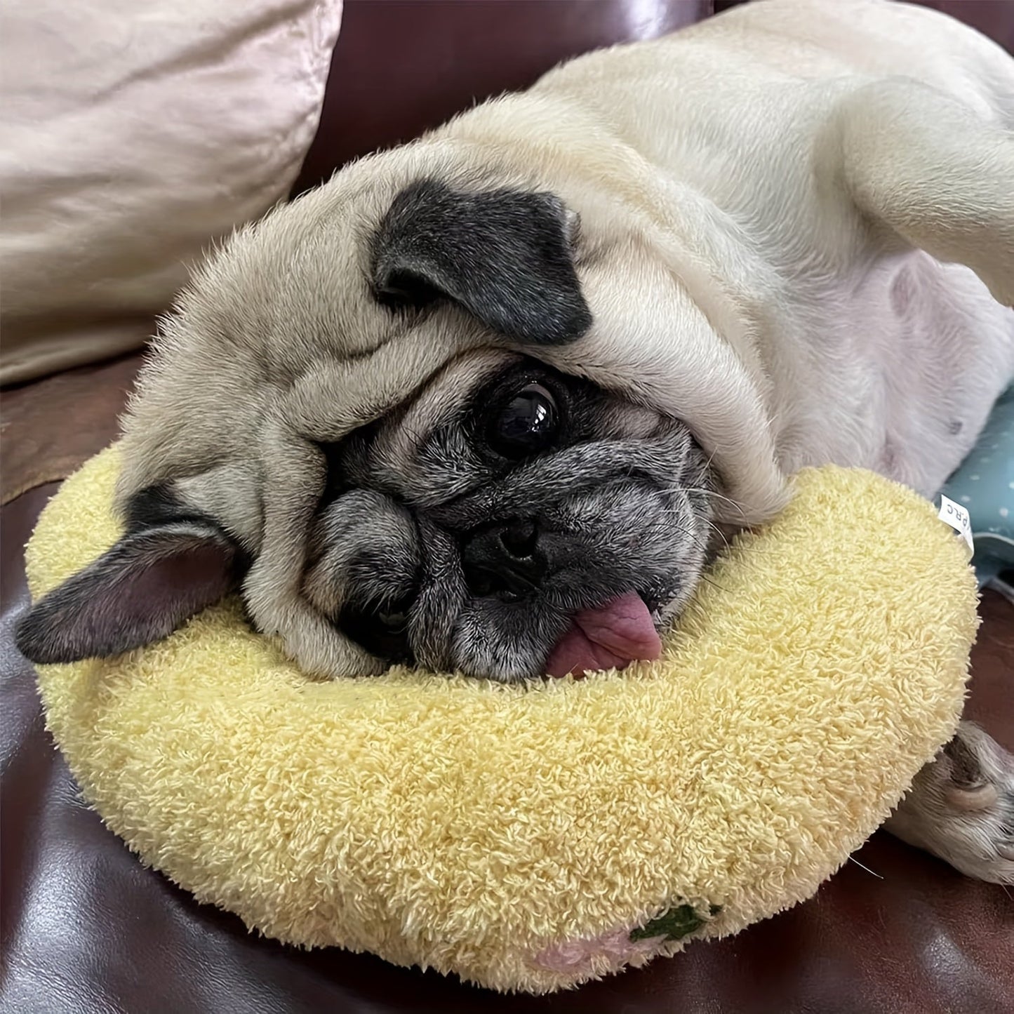 Calming plush dog neck pillow designed for small dogs, providing ergonomic sleep support and comfort. 7