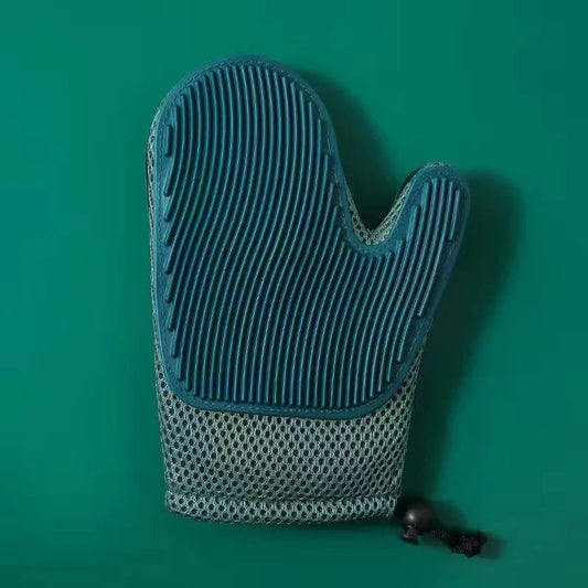 Cat grooming glove featuring an ergonomic design and soft silicone tips, perfect for easy fur removal on all fur types. 0