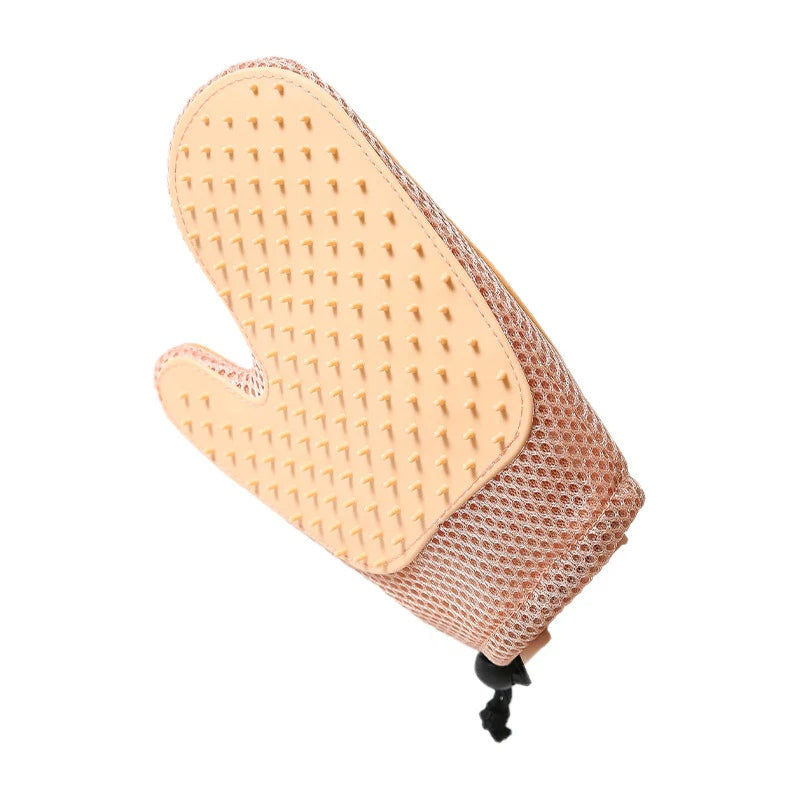 Cat grooming glove featuring an ergonomic design and soft silicone tips, perfect for easy fur removal on all fur types. 5