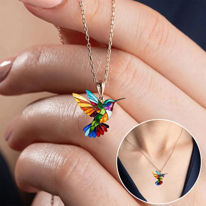 Colorful hummingbird necklace pendant featuring multicolor stained detail, crafted from gold-plated stainless steel, perfect for adding a vibrant touch to any outfit. 2