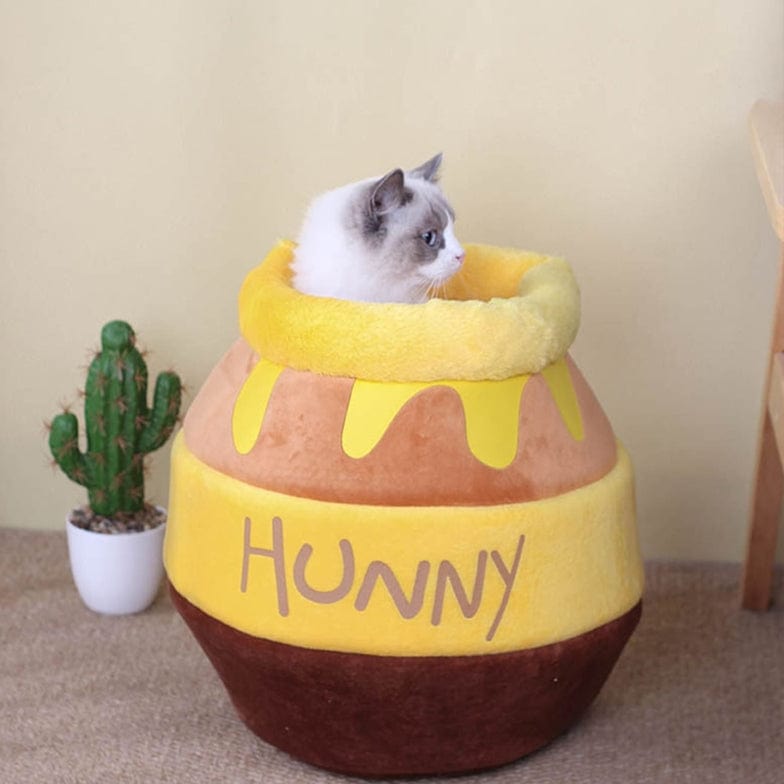 Cozy plush pet bed for cats and small dogs featuring a honey-pot design, ultra-soft fabric, and a comfortable indoor sleeping sanctuary. 2
