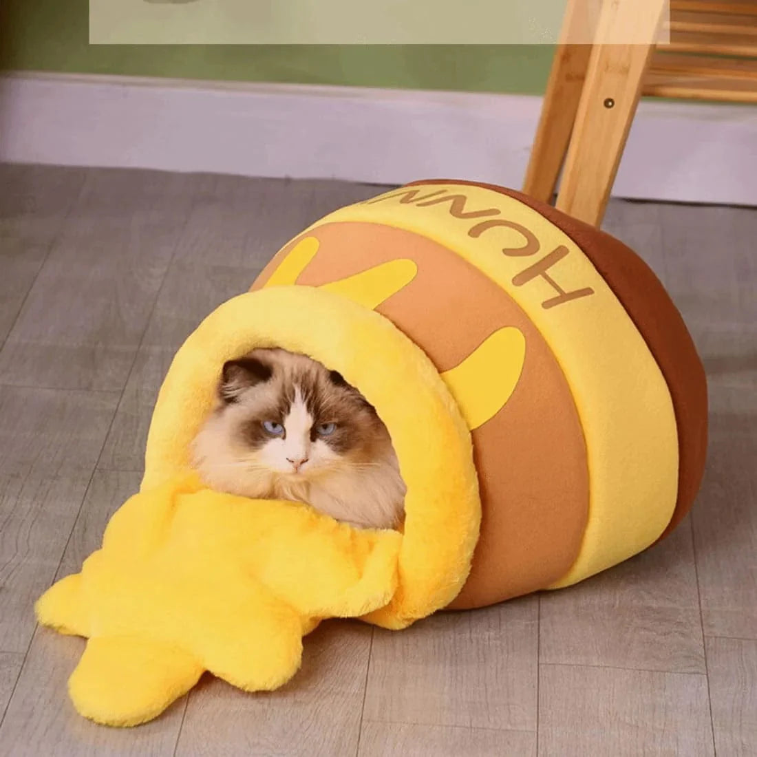 Cozy plush pet bed for cats and small dogs featuring a honey-pot design, ultra-soft fabric, and a comfortable indoor sleeping sanctuary. 5