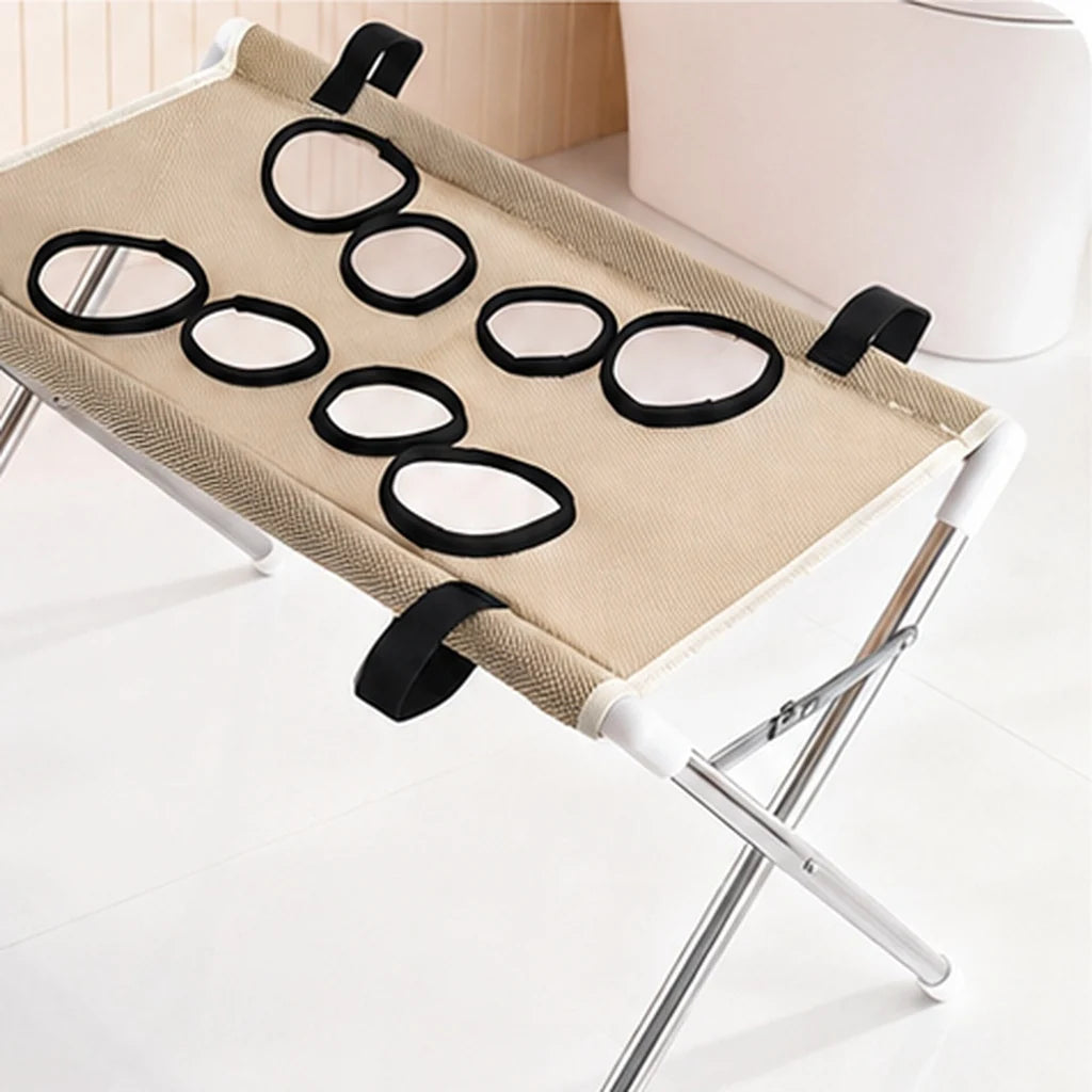 Dog grooming stand featuring adjustable openings and breathable mesh, designed as a foldable table for small dogs and cats, providing convenience and comfort during grooming sessions. 0