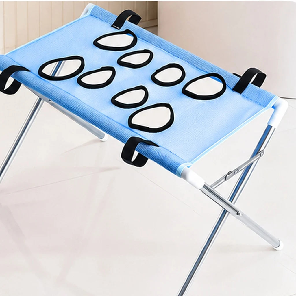 Dog grooming stand featuring adjustable openings and breathable mesh, designed as a foldable table for small dogs and cats, providing convenience and comfort during grooming sessions. 10