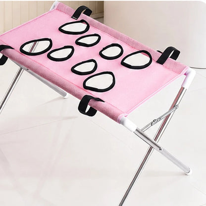 Dog grooming stand featuring adjustable openings and breathable mesh, designed as a foldable table for small dogs and cats, providing convenience and comfort during grooming sessions. 11