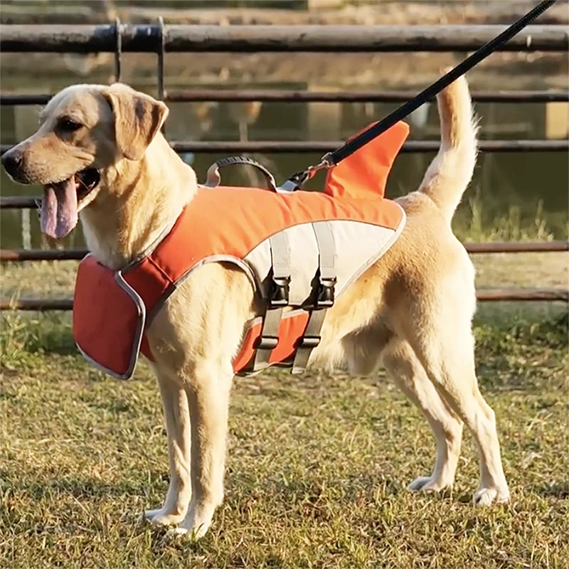 Dog life jacket featuring adjustable buoyancy and a fun shark fin design, perfect for swimming and water activities, ensuring safety and style for your furry friend. 5