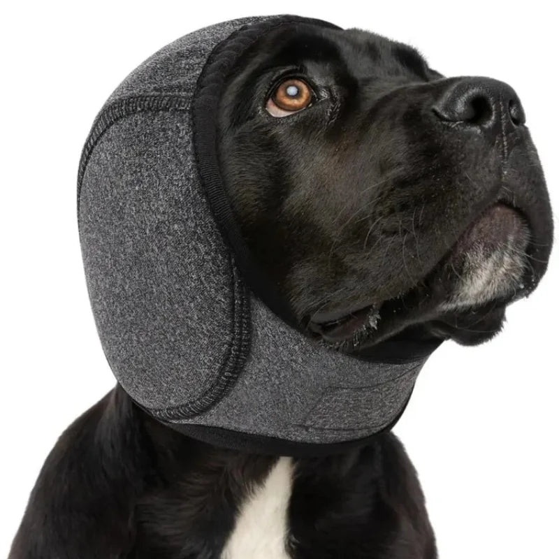 Dog noise-reducing hood made of soft polyester with waterproof protection, designed for anxiety relief, featuring ear covers for comfort and noise reduction. 0