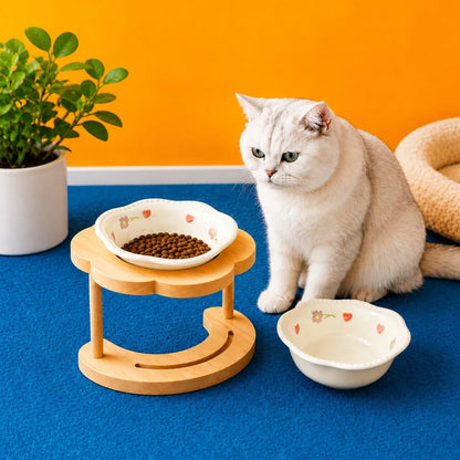 Elevated pet bowl featuring a tilted design, ideal for cats and small dogs, made of glazed ceramic and supported by a stylish wooden stand. 9