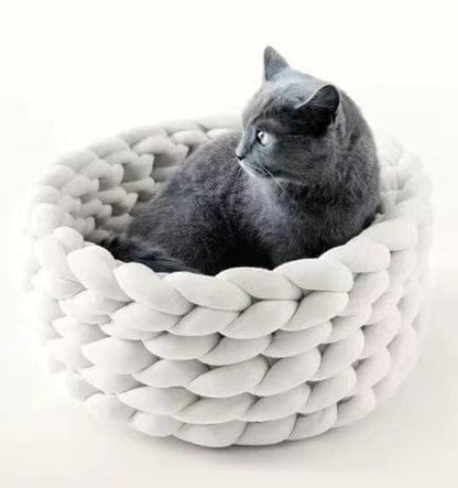 Handwoven cat bed in natural beige with a plush cushion and breathable design, perfect for small pets to relax and feel cozy. 4