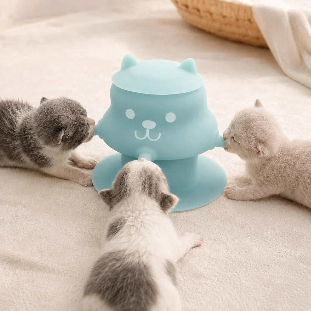 Silicone pet nursing feeder with suction base for kittens and puppies, featuring a 4-nipple design that is flexible and easy to clean. 0