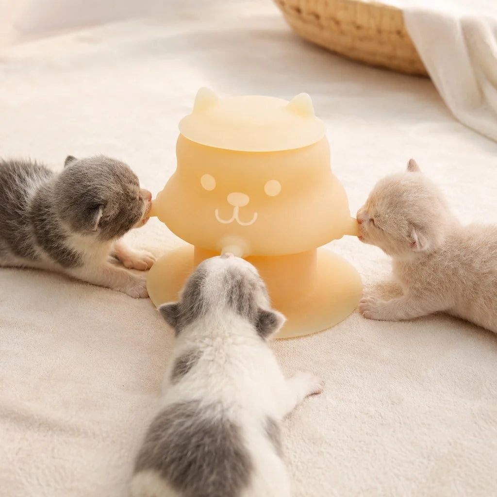 Silicone pet nursing feeder with suction base for kittens and puppies, featuring a 4-nipple design that is flexible and easy to clean. 1