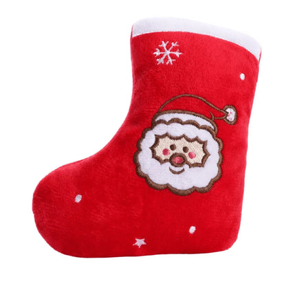 Squeaky dog toy in a festive Christmas stocking design, perfect for interactive play and holiday fun for pets. 6