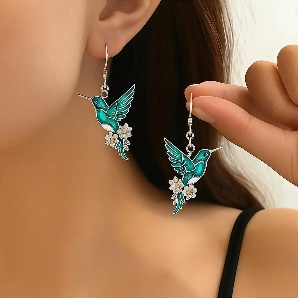 Sterling silver jewelry set featuring a stunning teal enamel hummingbird design, including a matching necklace and earrings, perfect for nature lovers and elegant occasions. 1