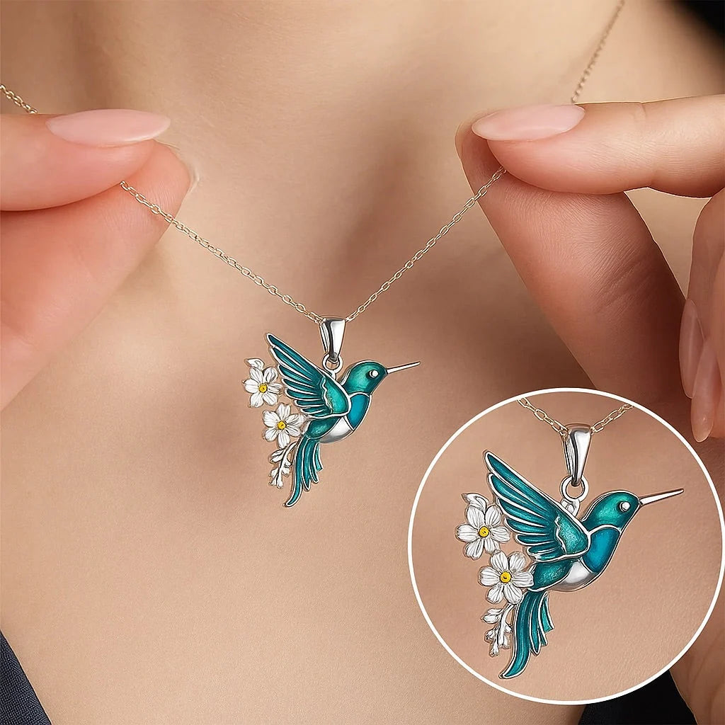 Sterling silver jewelry set featuring a stunning teal enamel hummingbird design, including a matching necklace and earrings, perfect for nature lovers and elegant occasions. 2
