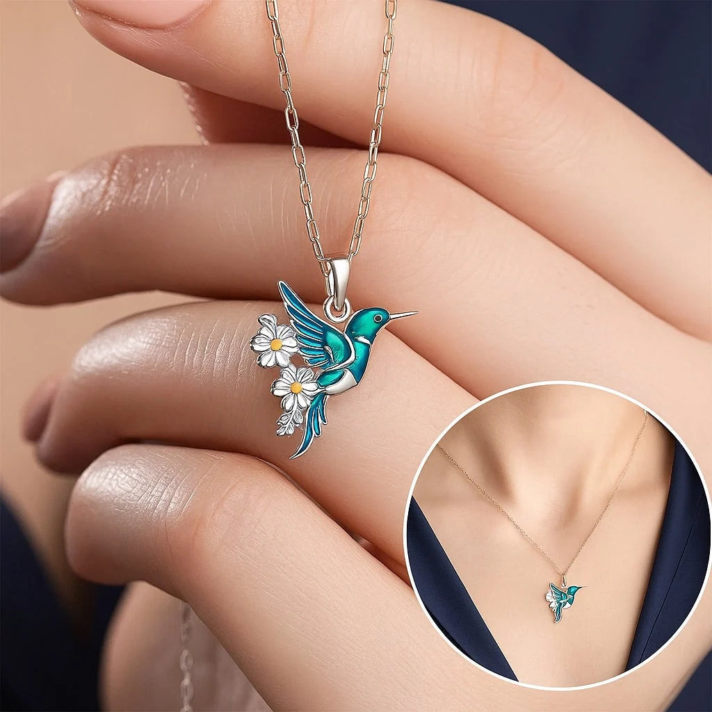 Sterling silver jewelry set featuring a stunning teal enamel hummingbird design, including a matching necklace and earrings, perfect for nature lovers and elegant occasions. 4