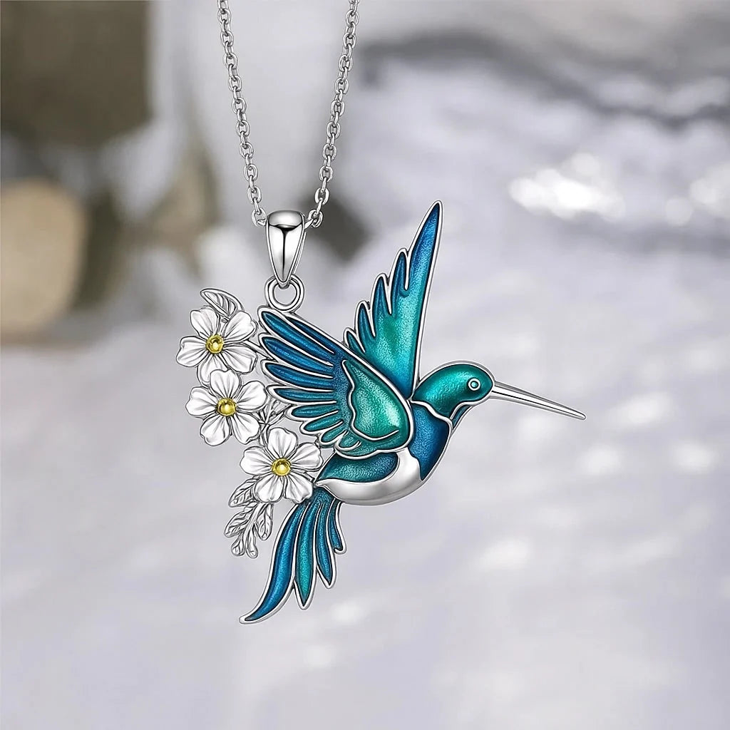 Sterling silver jewelry set featuring a stunning teal enamel hummingbird design, including a matching necklace and earrings, perfect for nature lovers and elegant occasions. 5